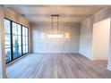 An elegant dining room featuring hardwood floors, stylish light fixtures, and large windows for an open, airy feel at 344 Michael Dr, Alpharetta, GA 30009