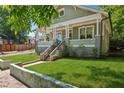 Beautiful craftsman-style home featuring lush green lawn, landscaped yard, and inviting entrance at 642 Erin Sw Ave, Atlanta, GA 30310