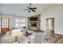 Cozy living room with a stone fireplace, vaulted ceilings and wood-look flooring at Lot 1 Perkins Rd, Dallas, GA 30157