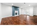 Spacious living room featuring beautiful hardwood floors and a cozy fireplace at 3575 Oakvale Rd # 301, Decatur, GA 30034