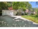 Charming single-story home with attached garage and well-maintained lawn and shade trees at 4234 Long Branch Ct, Brookhaven, GA 30319
