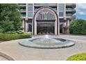 Luxurious building entrance with a water fountain and elegant architectural details at 750 Park Ne Ave # 6E, Atlanta, GA 30326