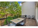 Relaxing outdoor deck with patio furniture and wooded view at 11259 Calypso Dr, Alpharetta, GA 30009