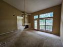 Spacious living room with fireplace and large windows providing lots of natural light at 3502 Tiffany Se Dr, Conyers, GA 30013