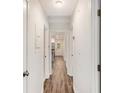 Bright hallway features modern wood-look floors and neutral paint at 46 Cooper Lake Sw Rd, Mableton, GA 30126