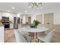 Beautiful kitchen features a breakfast area and stainless steel appliances and granite countertops at 11785 Mountain Laurel Dr, Roswell, GA 30075