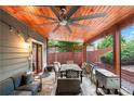 Inviting outdoor patio with a ceiling fan, comfortable seating, and a stone floor at 2412 Boulder Se Rd, Atlanta, GA 30316