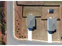Aerial view showcases the home's location on a corner lot with fenced backyard and neighborhood streets at 301 Amsterdam Way, Hampton, GA 30228