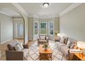 Bright, staged living room featuring hardwood floors and a bay window at 3517 Mortons Landing Dr, Ellenwood, GA 30294