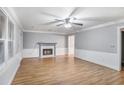 Bright living room features hardwood floors, a fireplace, and crown molding at 1417 Poplar Pointe Se, Smyrna, GA 30082