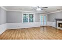 Spacious living room with hardwood floors, a fireplace, and natural light throughout at 1417 Poplar Pointe Se, Smyrna, GA 30082
