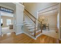 Inviting entryway showcasing hardwood floors, staircase, and views into the living and dining areas at 1765 Pinetree Pass Lane Southwest Sw Ln, Lilburn, GA 30047