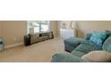 Cozy living room featuring a comfortable sectional sofa and neutral decor at 1765 Pinetree Pass Lane Southwest Sw Ln, Lilburn, GA 30047