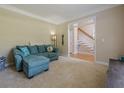 Living room featuring plush seating, neutral walls, and an inviting view of the home's entryway at 1765 Pinetree Pass Lane Southwest Sw Ln, Lilburn, GA 30047