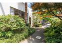 Attractive exterior with a garden, walkway, and mature trees, providing an inviting entrance to the property at 820 Dekalb Ne Ave # 2, Atlanta, GA 30307