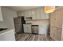 Well-lit kitchen featuring stainless steel appliances and ample cabinet space at 1194 Clichy Ct, Marietta, GA 30066