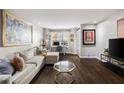 Comfortable living room area with hardwood flooring, a modern desk and natural light at 3063 Chastain Park Ne Ct, Atlanta, GA 30342