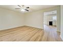 Bright living room featuring wood-look floors and a ceiling fan at 4547 Atha Cir, Loganville, GA 30052