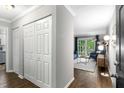 Inviting entryway leading to a well-lit living room with hardwood floors and ample closet space at 1150 Collier Nw Rd # L14, Atlanta, GA 30318