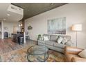 Cozy living area with a plush sofa and a colorful area rug at 361 17Th St # 2120, Atlanta, GA 30363