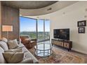 Open-concept living room with balcony access and comfortable seating at 361 17Th St # 2120, Atlanta, GA 30363