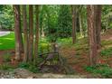 Picturesque creek with a quaint bridge amidst a lush, wooded setting at 1183 Woods Ne Cir, Atlanta, GA 30324