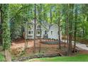 Beautiful home surrounded by lush greenery and mature trees at 1183 Woods Ne Cir, Atlanta, GA 30324