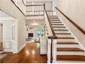 Inviting foyer featuring hardwood floors and a grand staircase at 1183 Woods Ne Cir, Atlanta, GA 30324