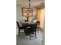 Cozy dining area featuring a modern light fixture, marble table, and a large sunflower centerpiece at 222 Yardsley Dr, Mcdonough, GA 30253
