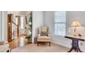 Cozy living room with a beige chair and window at 3574 Timberloch Trl, Snellville, GA 30039