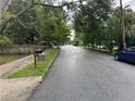 Peaceful neighborhood street with mature trees and well-kept homes creating a serene and inviting atmosphere at 2351 Carver Nw Dr, Atlanta, GA 30314