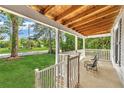Relaxing covered front porch with seating and a view of the neighborhood at 3961 Jodeco Rd, Mcdonough, GA 30253