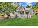 Beautiful one-story home with a covered front porch and manicured lawn at 3961 Jodeco Rd, Mcdonough, GA 30253