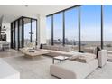 Contemporary living area with floor-to-ceiling windows offering stunning city views and lots of natural light at 788 W Marietta St # 1809, Atlanta, GA 30318