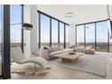 Bright and spacious living room with stylish furniture, floor-to-ceiling windows, and a cozy layout at 788 W Marietta St # 1809, Atlanta, GA 30318
