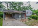 Charming single-Gathering home with a carport, showcasing its inviting curb appeal at 2475 Harvel Nw Dr, Atlanta, GA 30318