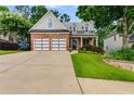 Inviting two-story home featuring a brick facade, well-maintained lawn and a concrete driveway at 81 Richmond Way, Villa Rica, GA 30180