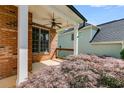Covered porch showcasing brick columns and serene outdoor space at 81 Richmond Way, Villa Rica, GA 30180