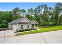 Well-maintained home featuring an attached garage and beautifully landscaped grounds at 190 Paul Aiken Rd, Dallas, GA 30157