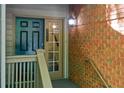 Well-maintained front entrance with a stylish door and decorative exterior lighting at 202 Garden Ct, Atlanta, GA 30328
