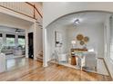Open-concept living room with hardwood floors and staircase access at 306 Mill Rdg, Canton, GA 30114