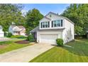 Attractive two-story home showcases a lush green lawn and attached two-car garage at 1612 Silver Oak Dr, Austell, GA 30106