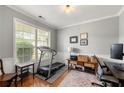 Bright home office space featuring hardwood floors, large window, and neutral paint at 1612 Silver Oak Dr, Austell, GA 30106