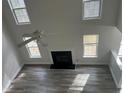 Bright living room with vaulted ceilings, fireplace, and abundant natural light at 2682 Field Spring Dr, Lithonia, GA 30058