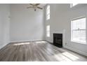 Spacious living room with soaring ceilings, fireplace, and abundant natural light at 2682 Field Spring Dr, Lithonia, GA 30058