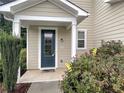Inviting front door entrance with a decorative glass window and well-kept landscaping at 265 Edinburgh Ln, Woodstock, GA 30188