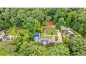 A sprawling estate features manicured gardens, a sparkling blue pool, and multiple outbuildings at 280 Blackland Nw Rd, Atlanta, GA 30342