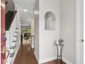 Inviting foyer featuring hardwood floors, stairs, and an arched mirror for added elegance at 812 Dixie Ne Ave, Atlanta, GA 30307