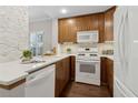 Modern kitchen with wooden cabinets, stainless steel appliances, and sleek countertops at 812 Dixie Ne Ave, Atlanta, GA 30307