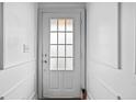 Clean, white door with multi-pane window and white trim at 262 Bell Grove Ln, Suwanee, GA 30024